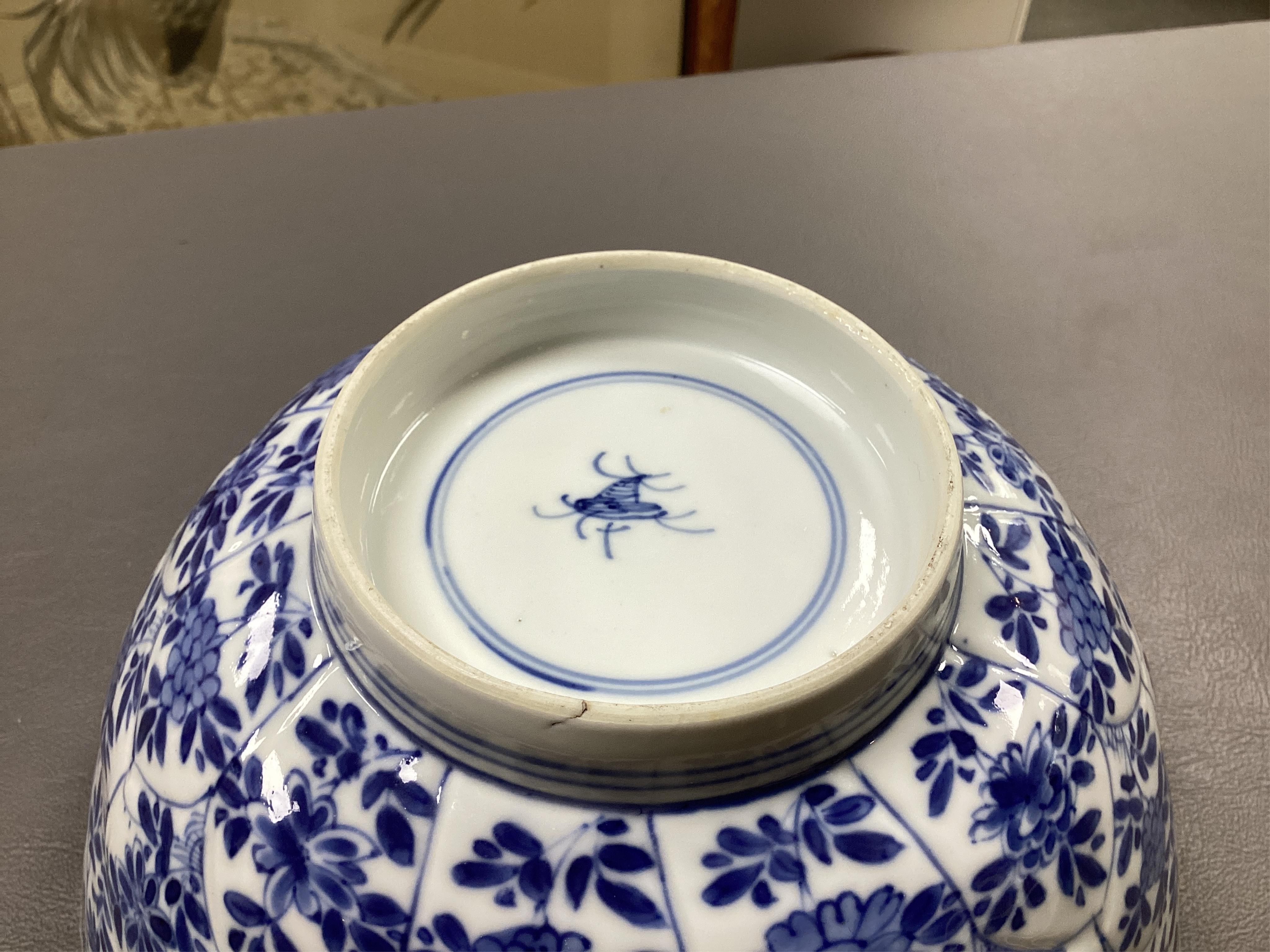 A near pair of Chinese blue and white lotus flower moulded bowls, Kangxi period